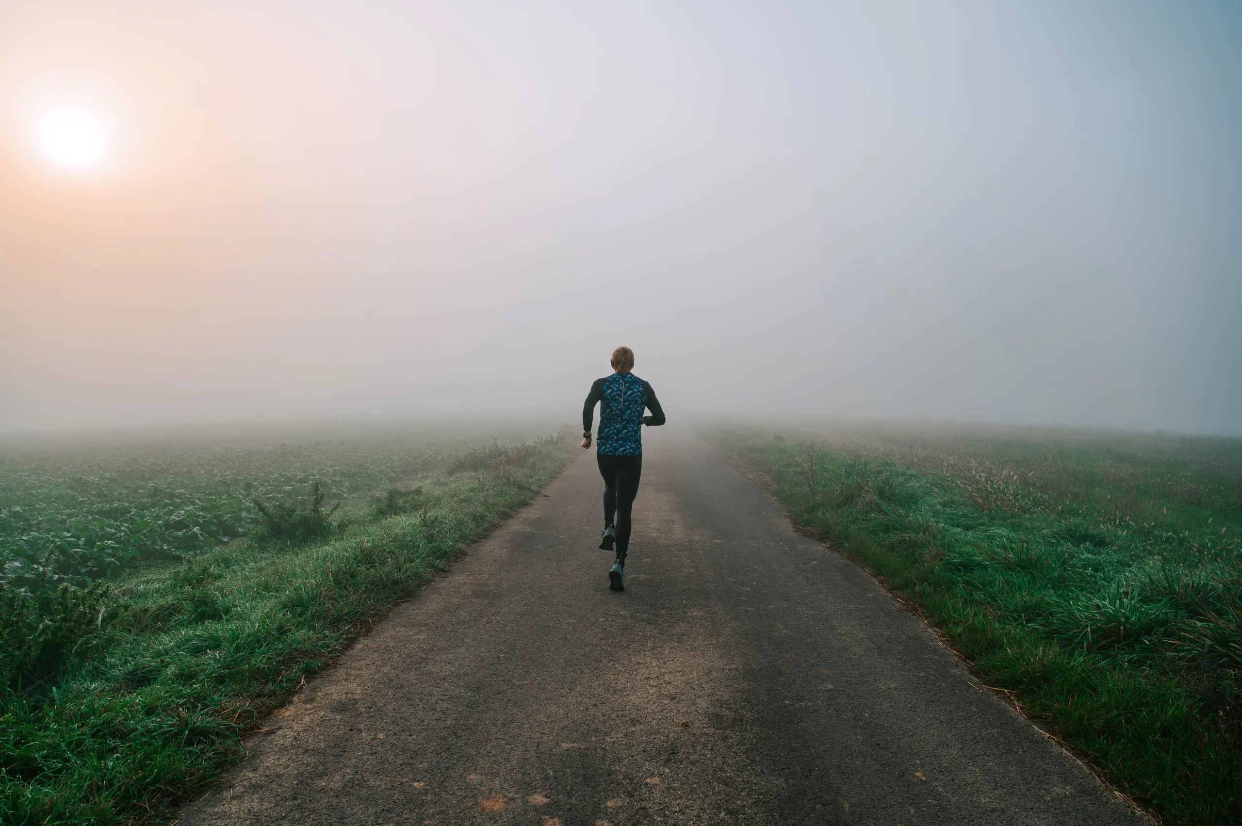 Individual walking forward along a peaceful path in morning light, symbolizing motivation and progress in cocaine addiction recovery